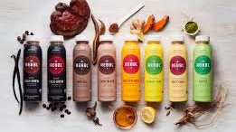Bottles of juice, many varieties.