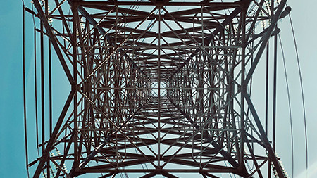 Looking upwards through a communication tower.