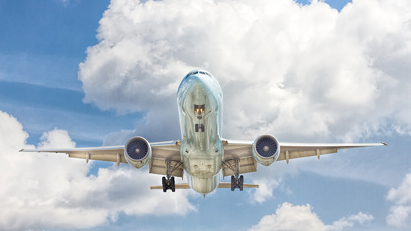 A jet airliner in flight, up in the sky.