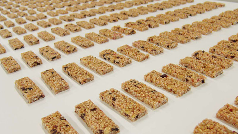 Rows of unpackaged snack bars.